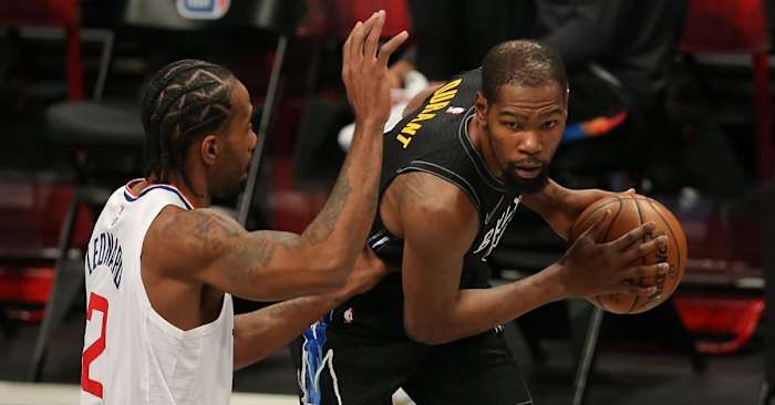 Brooklyn Nets power forward Kevin Durant (7) controls the ball against Los Angeles Clippers small forward Kawhi Leonard (2) during the first quarter at Barclays Center.